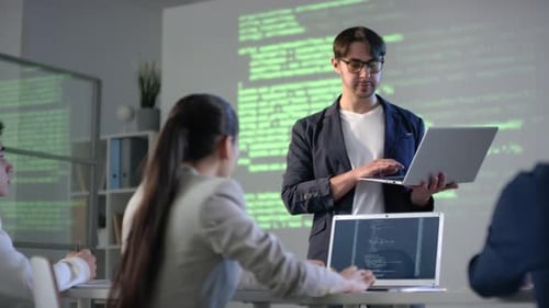 IT Teacher With Laptop Giving Lesson