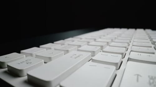 Close-up view of computer keyboard. Macro soft focus dolly shot