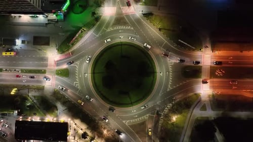 Aerial Top View Night Timelapse of Roundabout Cars at the Roundabout
