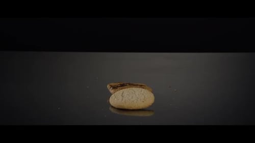 Falling cookies from above onto a reflective surface - COOKIES 240