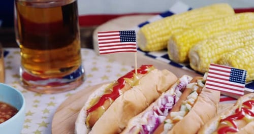 Hot dogs on wooden table with 4th july theme