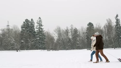 Family with Kid on Sleigh