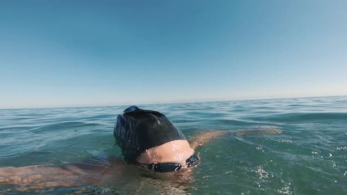 Underwater View of Man Swimming in the Ocean Clean Water Slow Motion