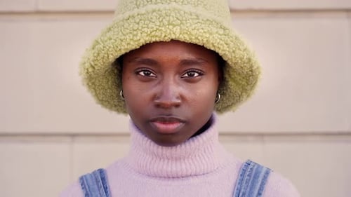 Close Up of Young Woman Wearing Green Bucket Hat