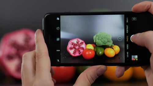 Woman Hands Takes Food Photo of Mixed Healthy Veggie with Vegetables and Avocado Chickpea Dip