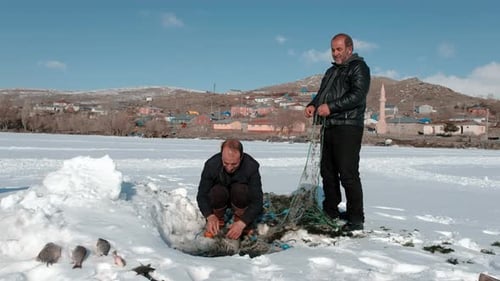 Villagers Fishing in the Frozen Lake