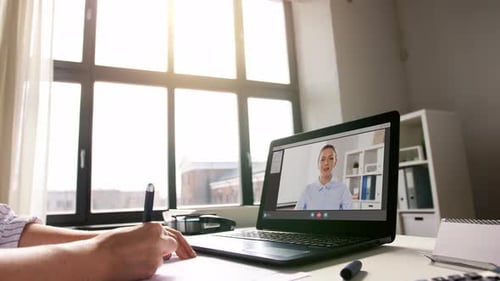 Woman with Laptop Having Video Call at Office