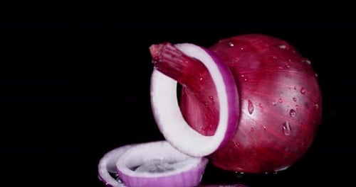 Vibrant Red Onion with Falling Slices