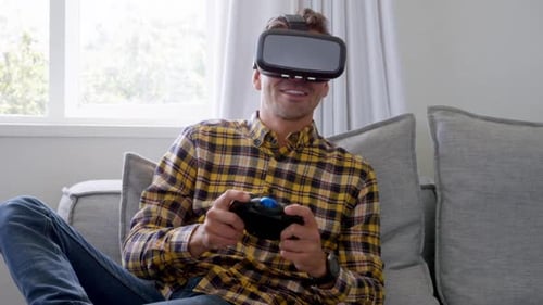 Man Plays Video Game with VR Headset at Home