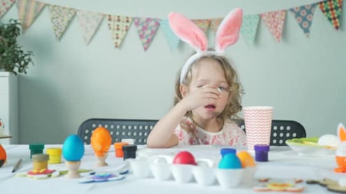 Little Girl Eating Egg After Easter Preparations