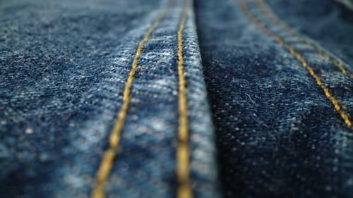 Close Up of Blue Denim Fabric with Stitching