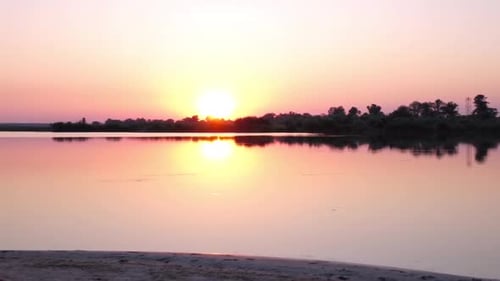 Girl Looks at the Sunset and Meditate