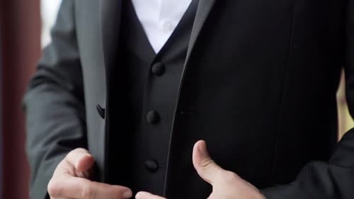 Close Up View of Hands of a Man in a Suit
