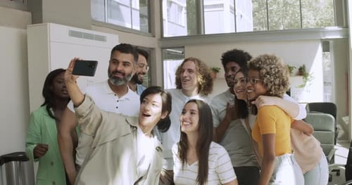 Group of Multiethnic Business Workers Taking a Selfie in the Office or Coworking