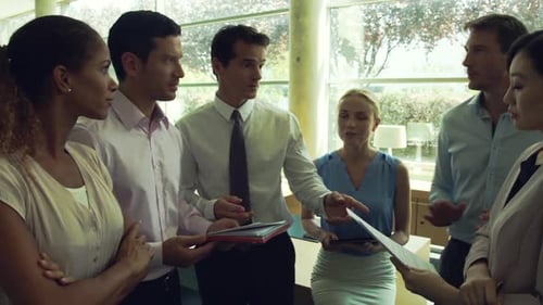 Diverse Group of Professionals Collaborate in Office