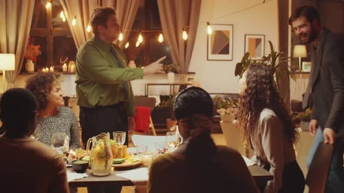 Friends and Family Gather Around Dinner Table