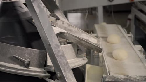 Making a Loaf of Bread in the Bakery. Loaf of Bread on the Production Line in the Baking Industry
