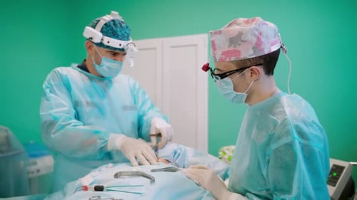 Surgeons Perform Operation in Hospital Operating Room