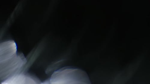 Abstract Sparkling Light Effects on Dark Background