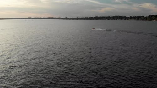drone shot jet ski passing by