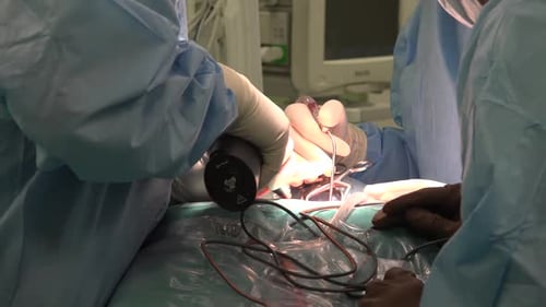 Surgeons Performing Delicate Surgical Operation in Hospital