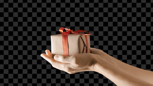 Hands Holding Birthday Present with Red Ribbon