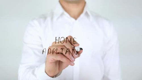 Man Writes Home Appliance on Clear Surface
