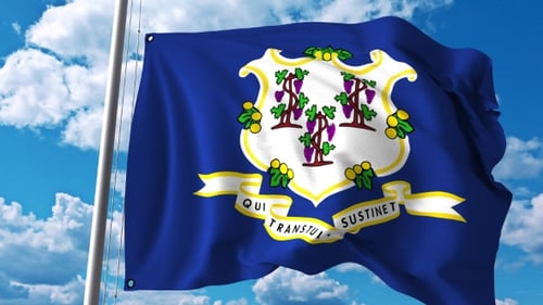 Waving Flag of Connecticut State Against Blue Sky