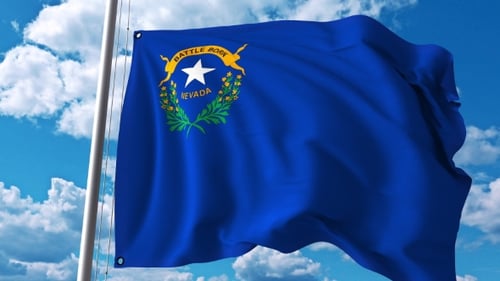 Nevada State Flag Waving in Realistic Wind Against Blue Sky