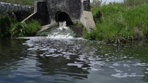 Water Flowing Out of Drainage Pipe into Stream