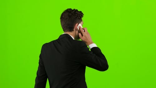Man Goes To Work and Talks on the Phone. Green Screen
