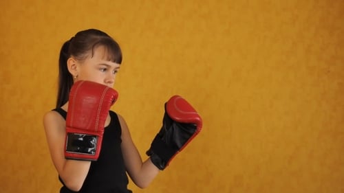 A Little Girl in Boxing Gloves