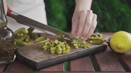 Chef Shreds Pickled Cucumbers on the Wooden Board , Makin of Salad, Vegetable Meal, Vitamins in