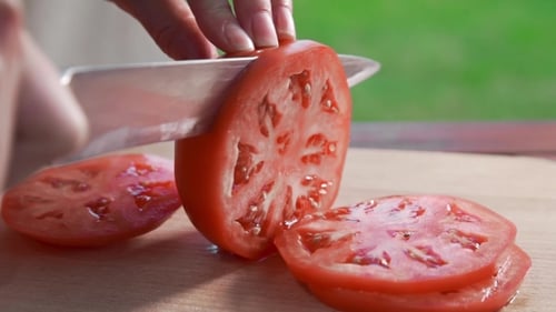 Slicing a Fresh Tomato with a Knife