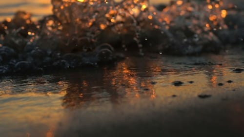 Golden Waves on Beach at Sunset