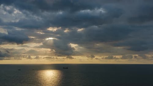 Romantic colorful sunset at the sea. Against the background of the sea the sun goes down