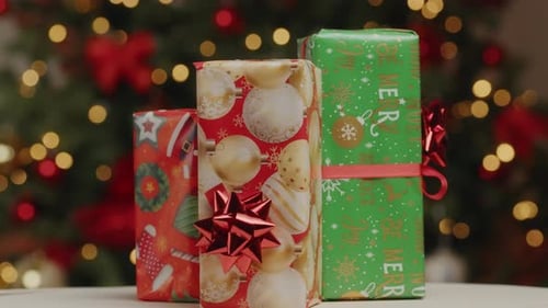 Festive Christmas Presents in Front of Christmas Tree