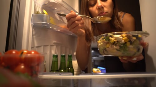Woman Enjoys Late Night Salad from Refrigerator