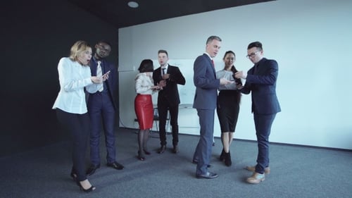 Team poses for picture in modern office