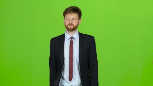 Businessman Walks Calmly Down the Street, He Is Happy. Green Screen