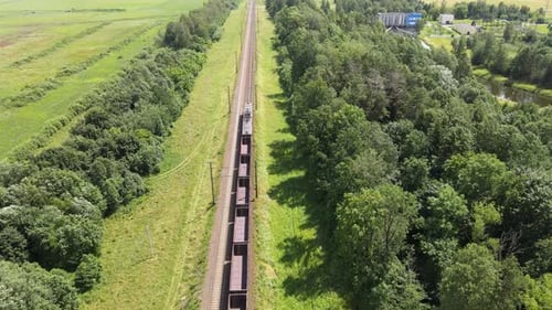 Freight Train Journey Through Lush Green Countryside