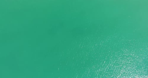Top Down View Of Turquoise Water Of The Ocean