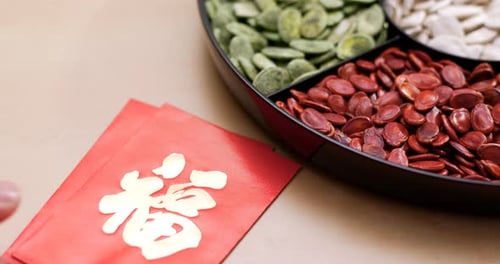 Tray of Seeds with Red Envelopes for Lunar New Year