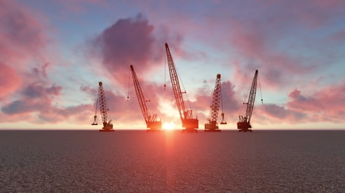 Construcción de edificios grúa y puesta de sol