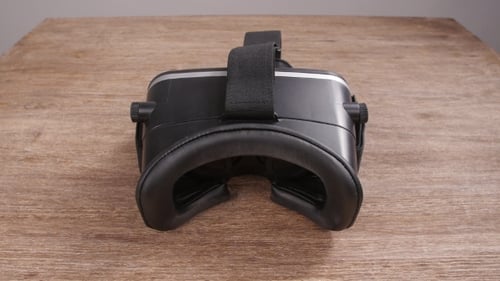 Hands Pick up Virtual Reality Headset