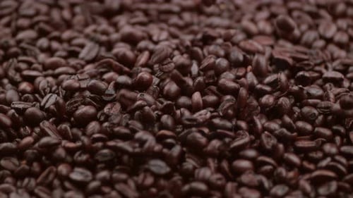 Roasted Coffee Beans Falling in a Heap