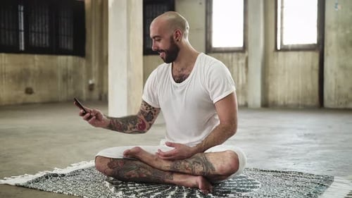 Man Continuous Texting on Mobile Phone