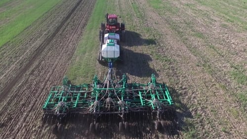 Aerial View of Tractor Sowing Wheat