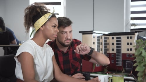 Designers Working with Model of Building Using VR