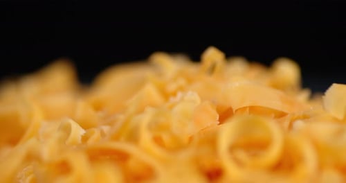 Grated Cheddar Cheese Slowly Rotates.